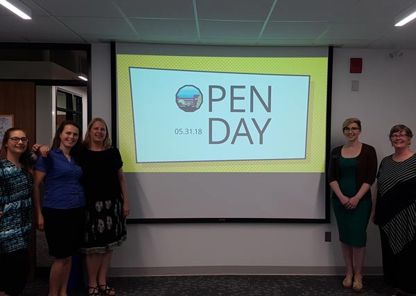 Photo from Open Day: Team standing around the slideshow