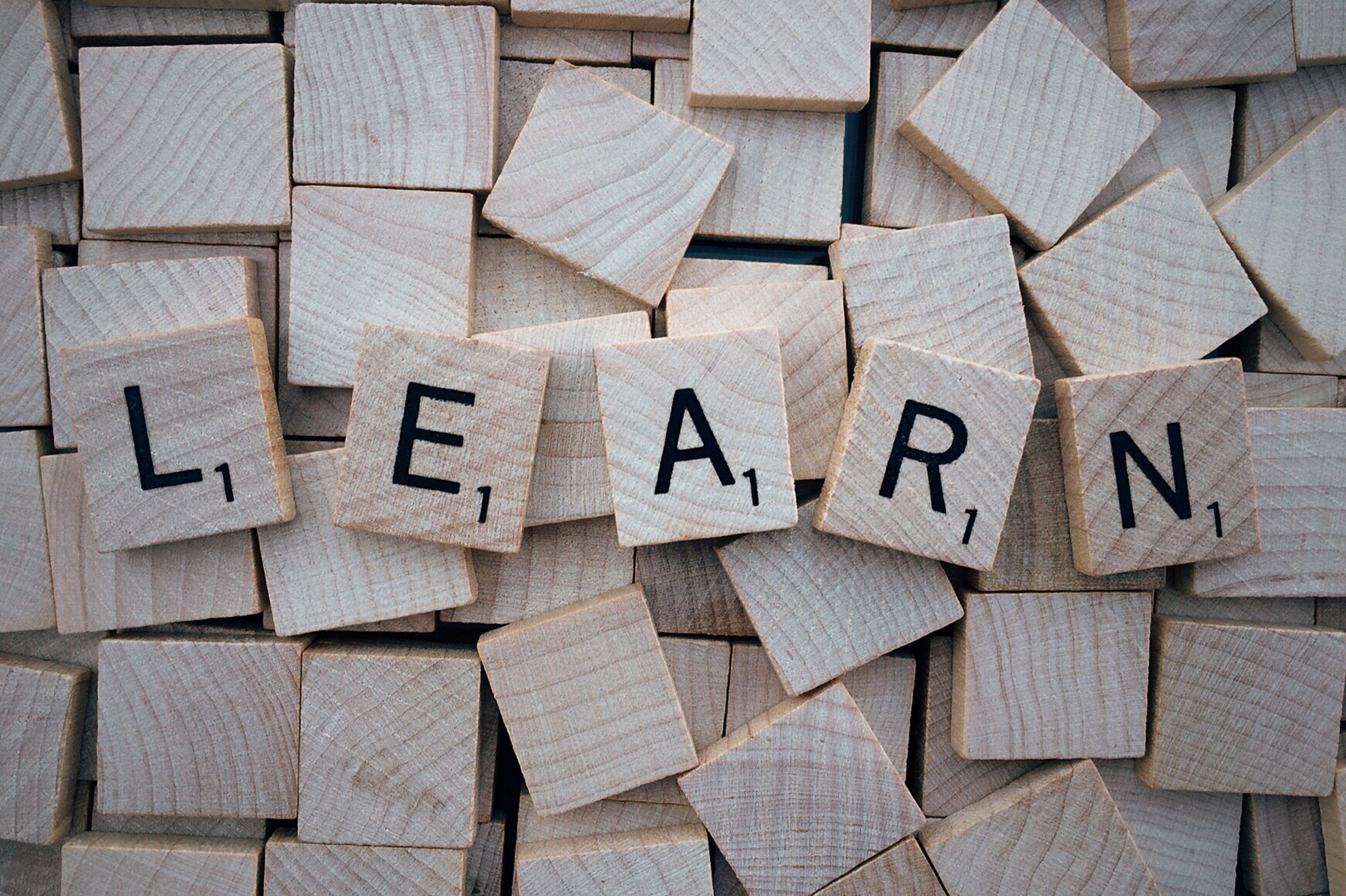 Photo of the word learn spelled out on Scrabble tiles from Pexels licensed under CC0