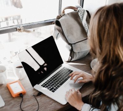 Student in front of laptop, typing