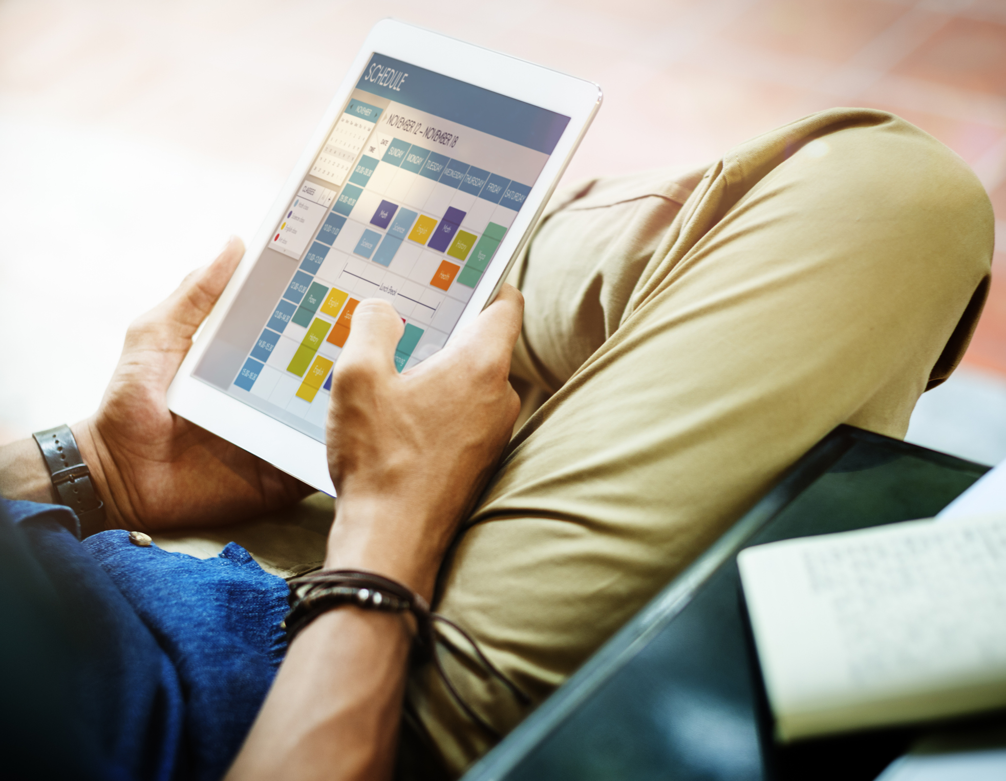 Student planning a schedule on an iPad
