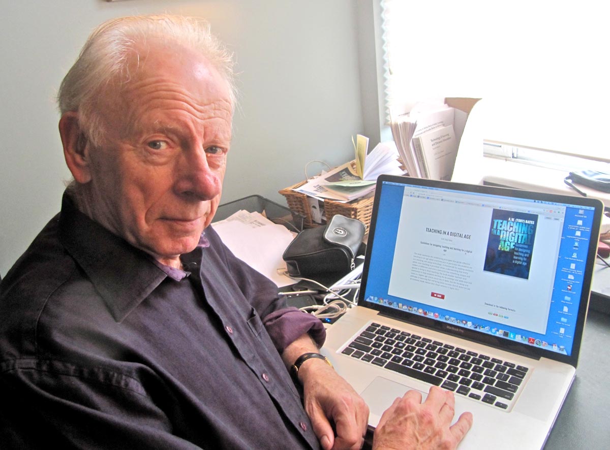 Tony Bates in front of a PC