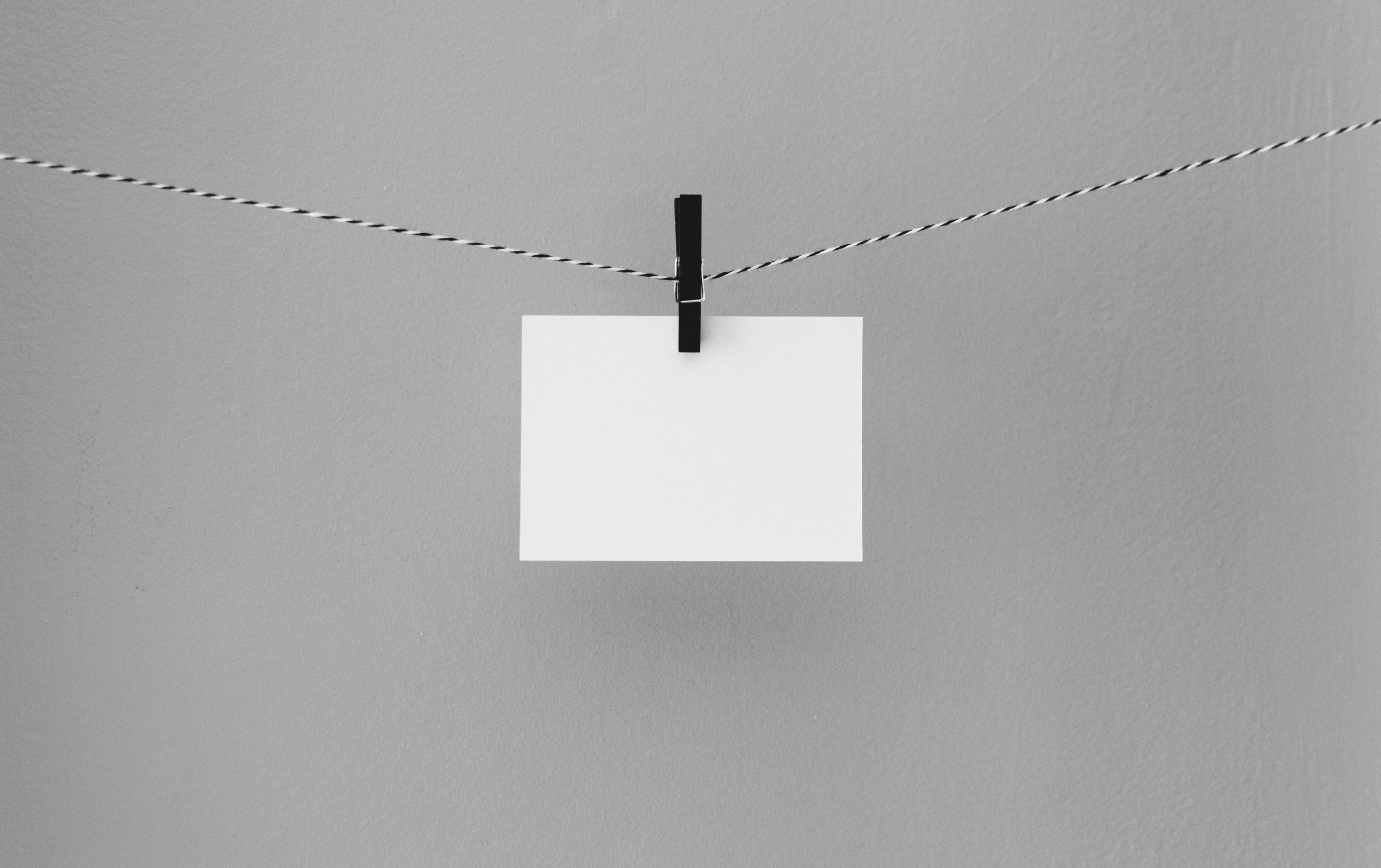 Blank card hanging on a string